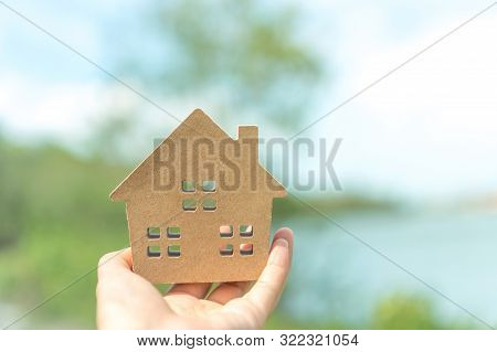Copyspace Model Of A Little House That Woman Holds It Background. Deam Life Have Own House Property 