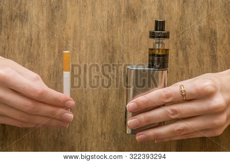 Vape And Cigarettes Holding A Girl In Her Arms