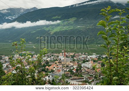 The City Of Schlanders (south Tyrol, Italy) From Above On A Cloudy Day In Summer