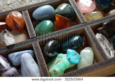 Box With Different Beautiful Gemstones On Table, Closeup