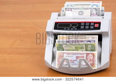 Old Bolivian Boliviano In A Counting Machine