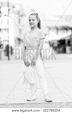 Kid Long Hair Enjoy Walk Sunny Day. Summer Holidays. Charming Stylish Fashionable Girl. Little Child