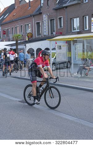 Sint Gillis Waas, Belgium, 2 September 2019, Man With Helmet And Black Bike Is Warming Up To Begin T