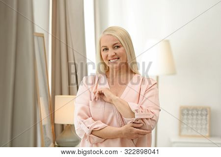 Portrait Of Happy Mature Woman At Home