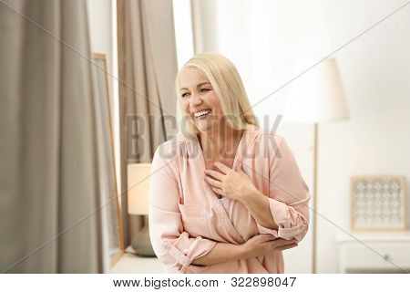 Portrait Of Happy Mature Woman At Home