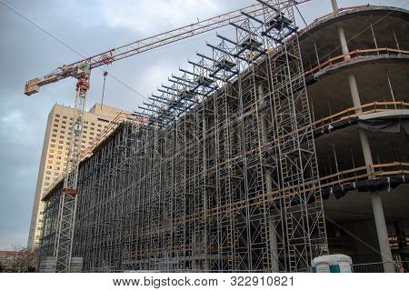 Construction Site Of A Modern Office, Bank And Commercial Building With Equipment And Supports
