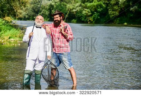 Hobby And Recreation. Fisherman In Formal Suit. Successful Catch. Friends Fishing. Elegant Bearded M