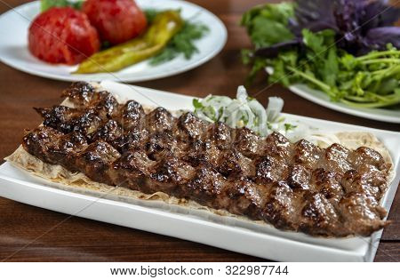 Fast Food. Eastern Food. Shish Kebab, Lyulya-kebab. Dishes Of Oriental Cuisine Lying In Plte And Dec