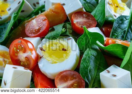 Foodbackground Close-up. Egg Salad, Spinach, Cheese, Cherry Tomatoes And Flax Seeds