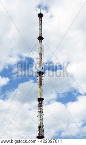 The Plot Of The Tower Close-up. Tv Tower Against A Cloudy Blue Sky.
