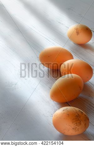 Fresh Brown Farm Chicken Eggs White Wooden Shadow Table Background.