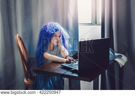 Funny Girl In Blue Wig Learning At Distant Remote Virtual School Online. Homeschooling Class Educati