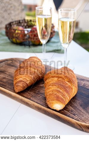 Breakfast With Fresh Baked Croissants And  Brut Champagne Sparkling Wine In Flute Glasses Served On 