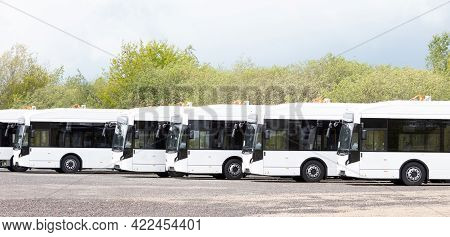 Long White Busses, Large Capacity Public Transport