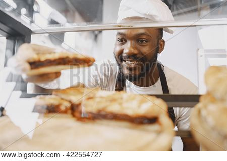 Agrican American Baker Selling Buns In Cafeteria