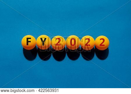 Fiscal Year 2022 And Business Symbol. The Concept Word 'fy, Fiscal Year 2022' On Orange Table Tennis