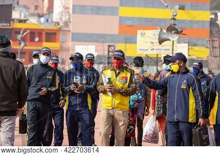 Haridwar, Uttarakhand India April 06, 2021. Policemen Spreading Awareness Of Protection From Coronav