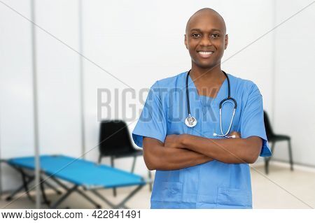 Handsome Mature Adult Afro American Male Doctor At Vaccination Station For Vacinating Patients