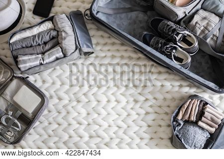 Top View Composition With Neatly Packing Things, Clothes And Accessories For Travel Konmari Method