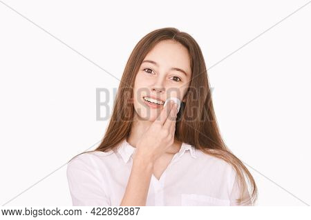 Pretty Girl Indoor Portrait. Light Background. Female Teenager Person. Long Brow Hair. Cleansing Dir