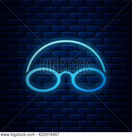 Glowing Neon Glasses And Cap For Swimming Icon Isolated On Brick Wall Background. Swimming Cap And G