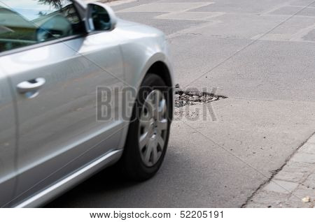 Asphalt`s Holes On Roadbed. Car In A Motion.