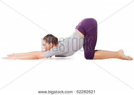 Young Woman Doing Yoga Exercise Uttana Shishosana (extended Puppy Pose)