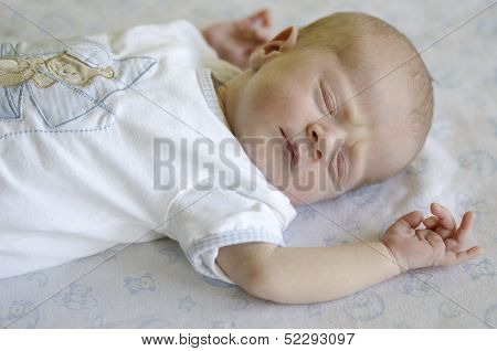 Cute Baby Sleeping On Its Back