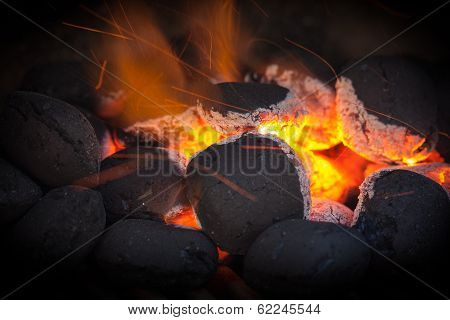 Charcoal Briquettes With Fire Sparks.black Vignette.