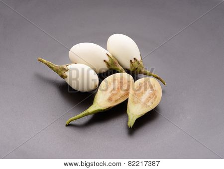 Fresh White Eggplants On Gray Plate