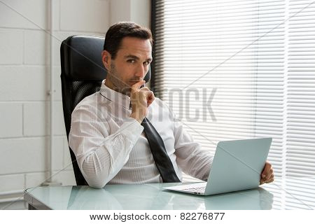 l male businessman looking at camera