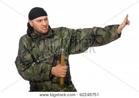 Young man in soldier uniform holding nunchaks isolated on white