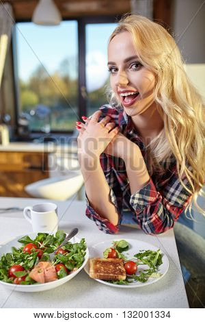 Woman in home eating breakfast