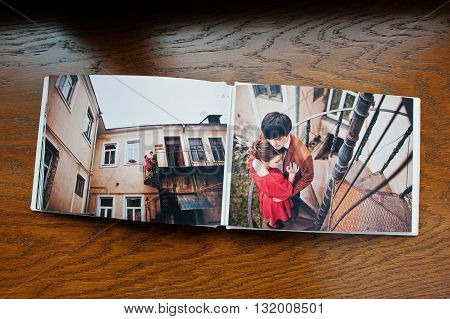 Open Pages Of Album Photobook Couple In Love On Wooden Background