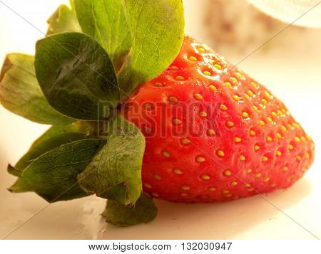 Big red strawberry in kitchen detail - raw food