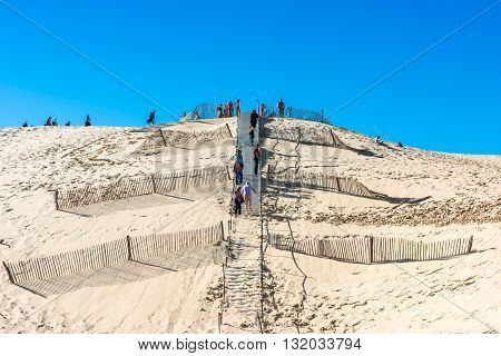 People Visiting The Highest Sand Dune Of Pyla In Europe