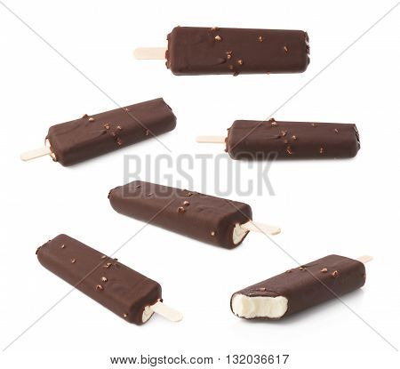 Chocolate covered vanilla ice cream bar with nuts on a wooden stick, isolated over the white background, set of multiple different foreshortenings