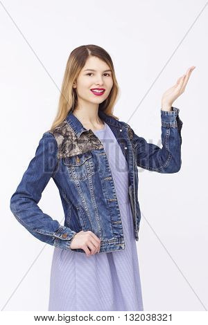 Advertising. Beautiful women in jaclet and dress. Palms up on copyspace