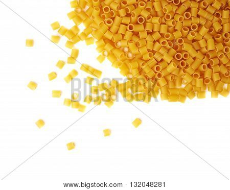 Pile of dry ditalini yellow pasta over isolated white background