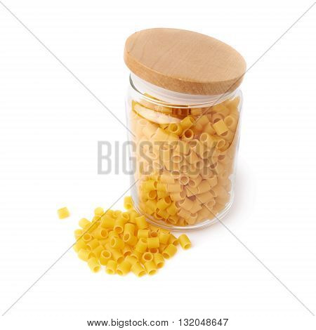 Glass jar filled with dry ditalini yellow pasta over isolated white background