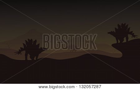 At night Stegosaurus in hills scnery silhouette a very beautiful