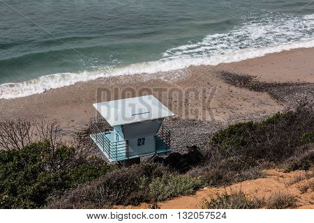 View from above of a lifeguard tower at South Carlsbad State Beach in Carlsbad, California.