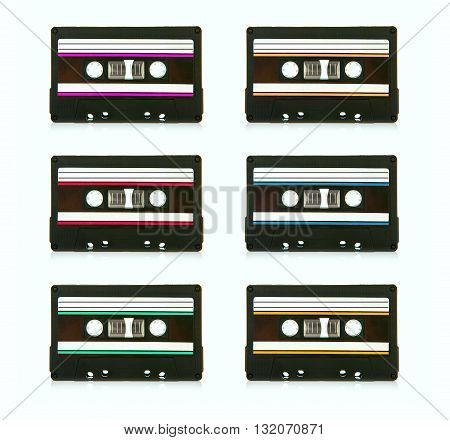6 vintage compact cassette audio tapes on a white background