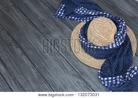 A scarf tied on a women's hat.