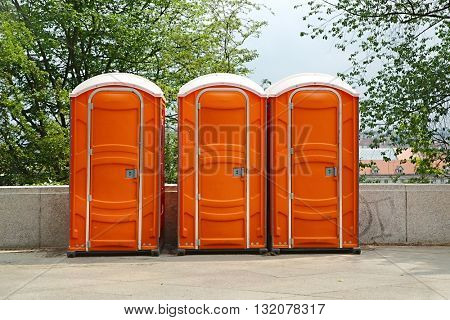 Row of mobile toilets in an urban area