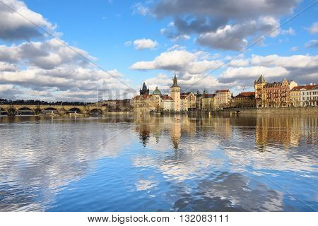 clouds are reflected in the river Vltava, Prague