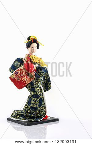 Japanese geisha dolls on the white background.