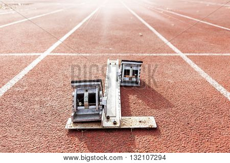 starting blocks on running tracks sport concept
