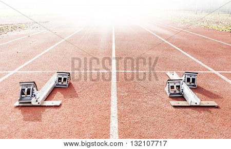 starting blocks on running tracks sport concept