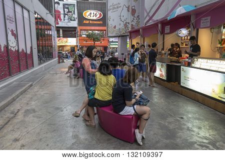 BANGKOK THAILAND - APR 30 : people in alley side of Digital Gateway in siam square on april 30 2016 thailand. siam square is famous shopping place of Bangkok